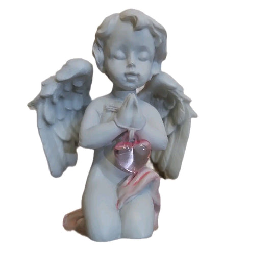 Cherub with pink crystal heart