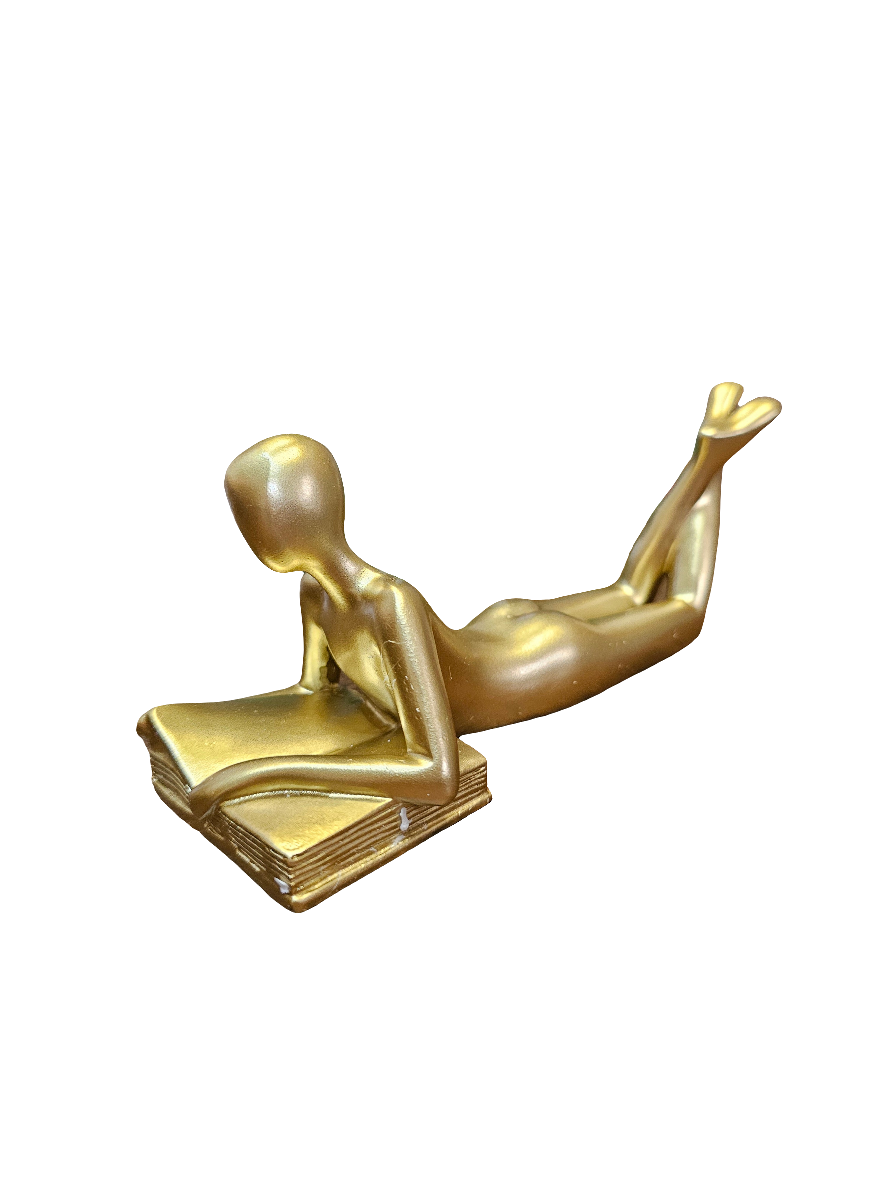 Gold Reader lying down statue