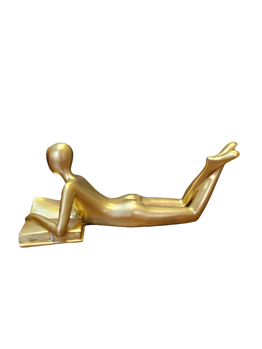 Gold Reader lying down statue