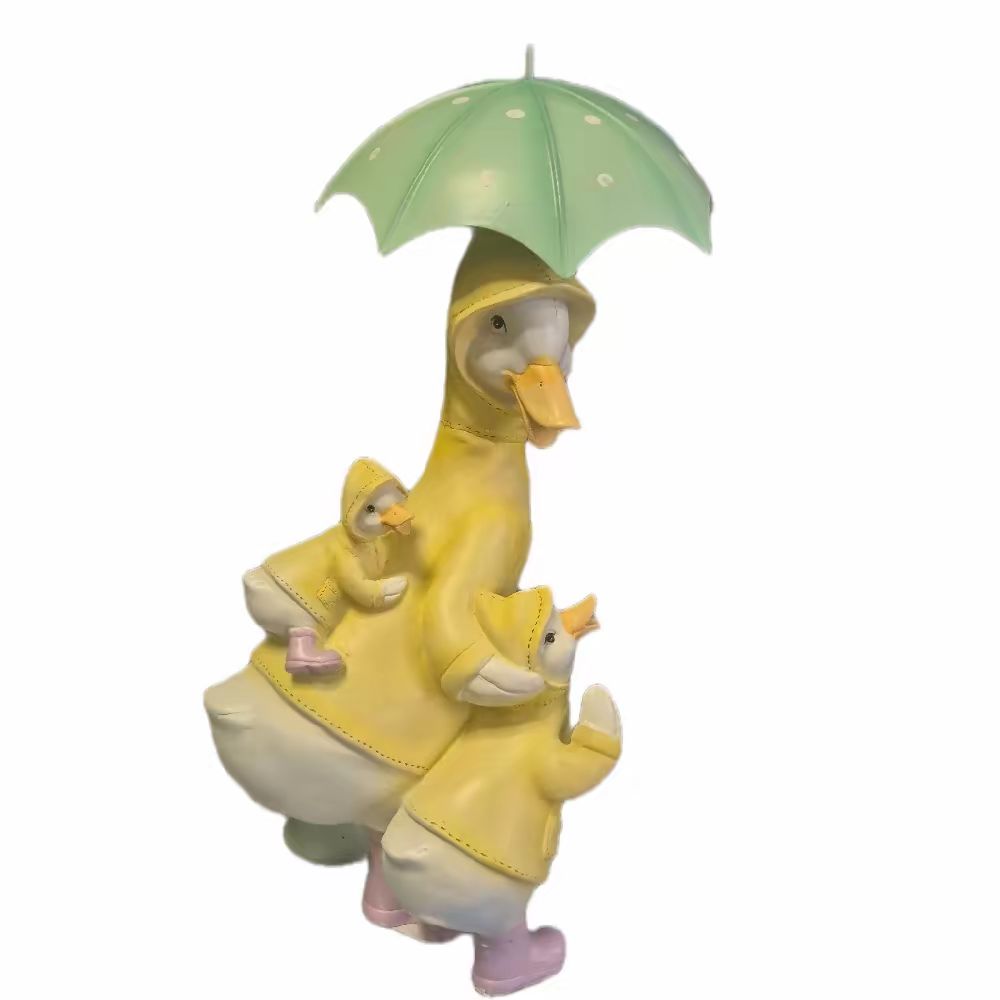 Family of Ducks Under Umbrella