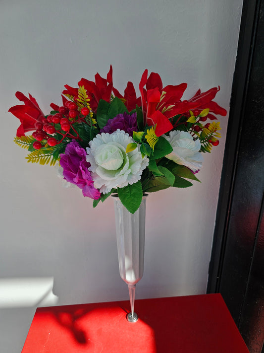 Artificial flower bouquet in vase with ground stake