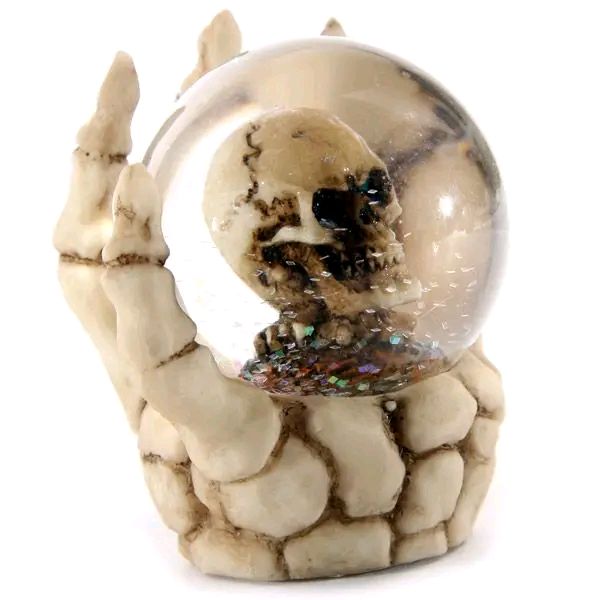 Skull Glitter Globe In Skeleton Hand