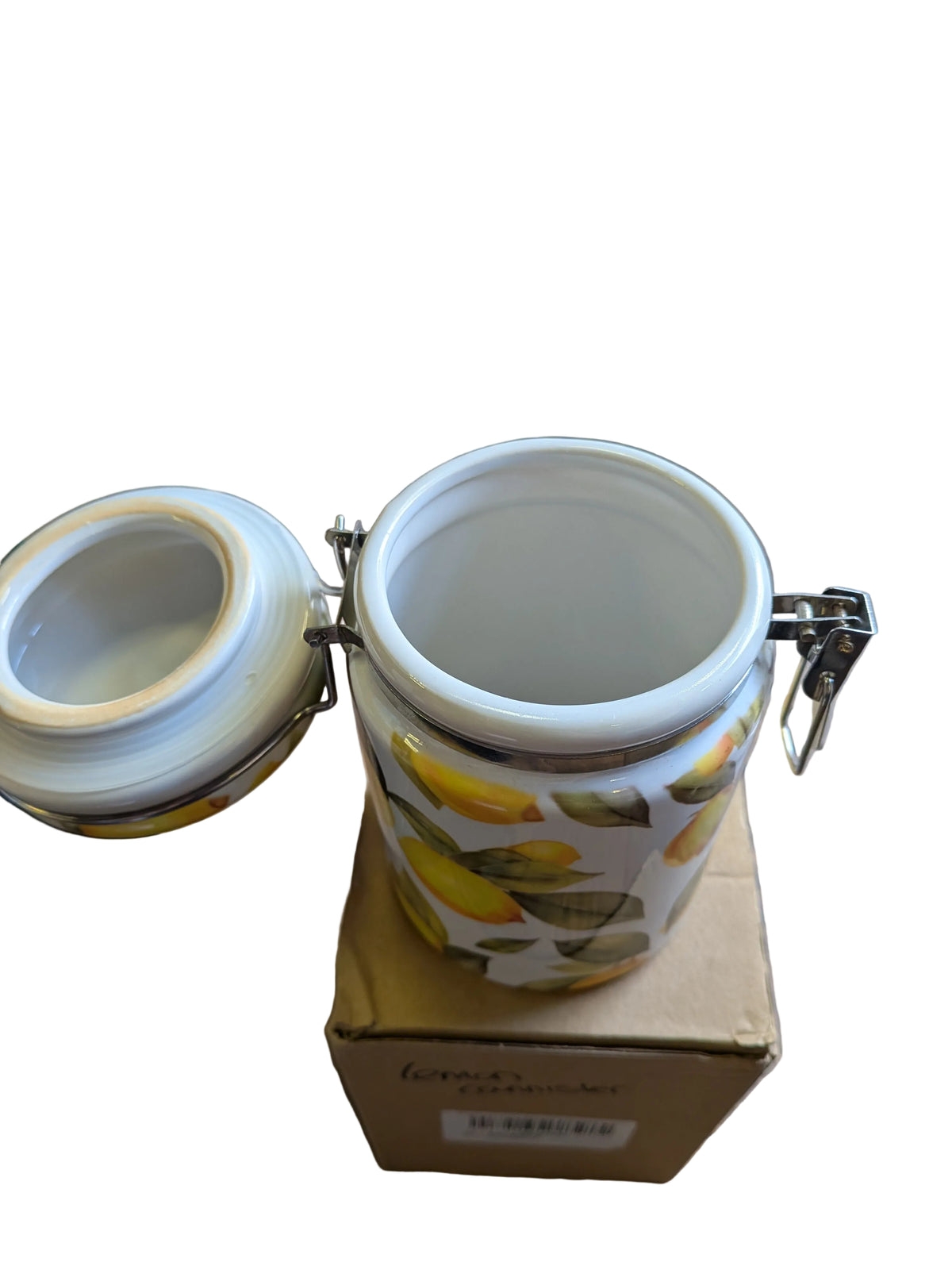 Ceramic kitchen storage canister with a lemon pattern and a wire-clamp airtight lid