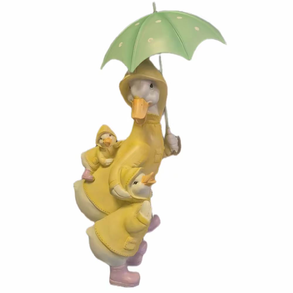 Family of Ducks Under Umbrella