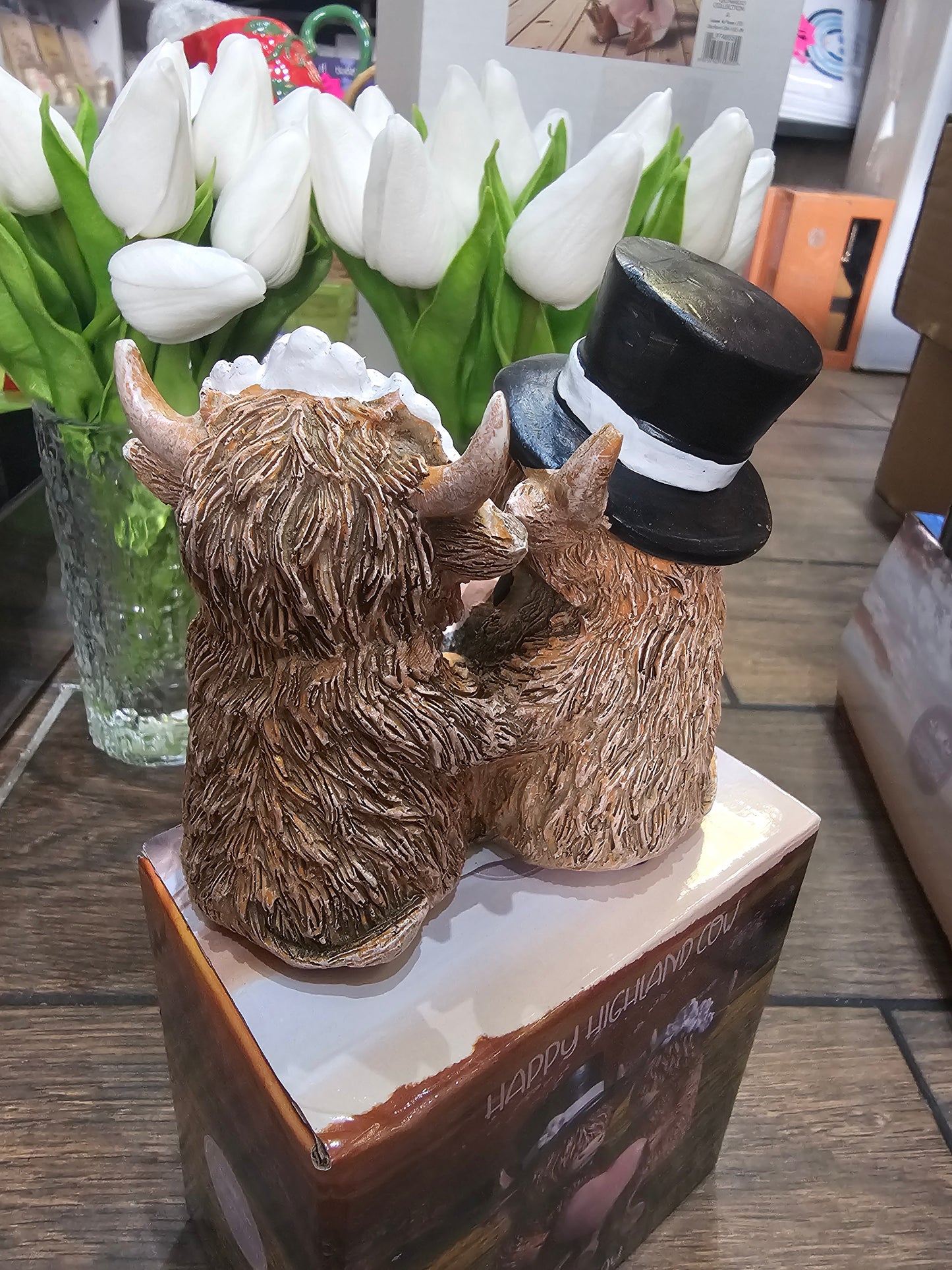 Happy Highland Cow Wedding Day statue with dangling legs