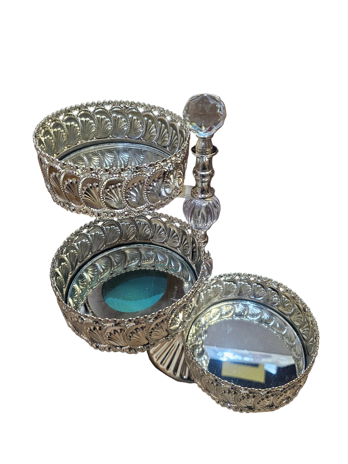 Silver-plated tiered metal cake or candy stand with a mirror top and shell detailing