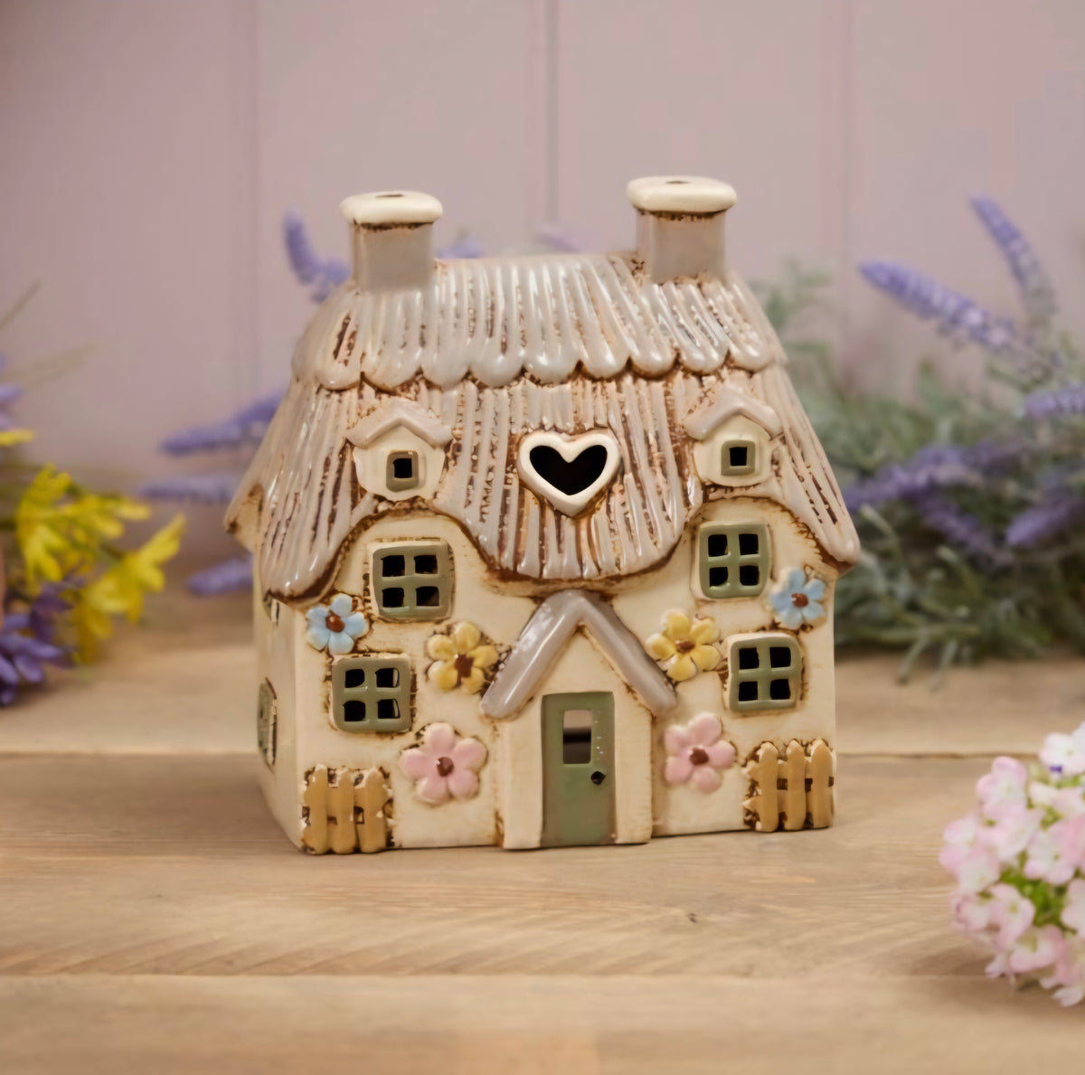 STONEWARE LARGE THATCHED COTTAGE WITH EMBOSSED FLOWERS AND GREEN DOOR TEA LIGHT HOLDER