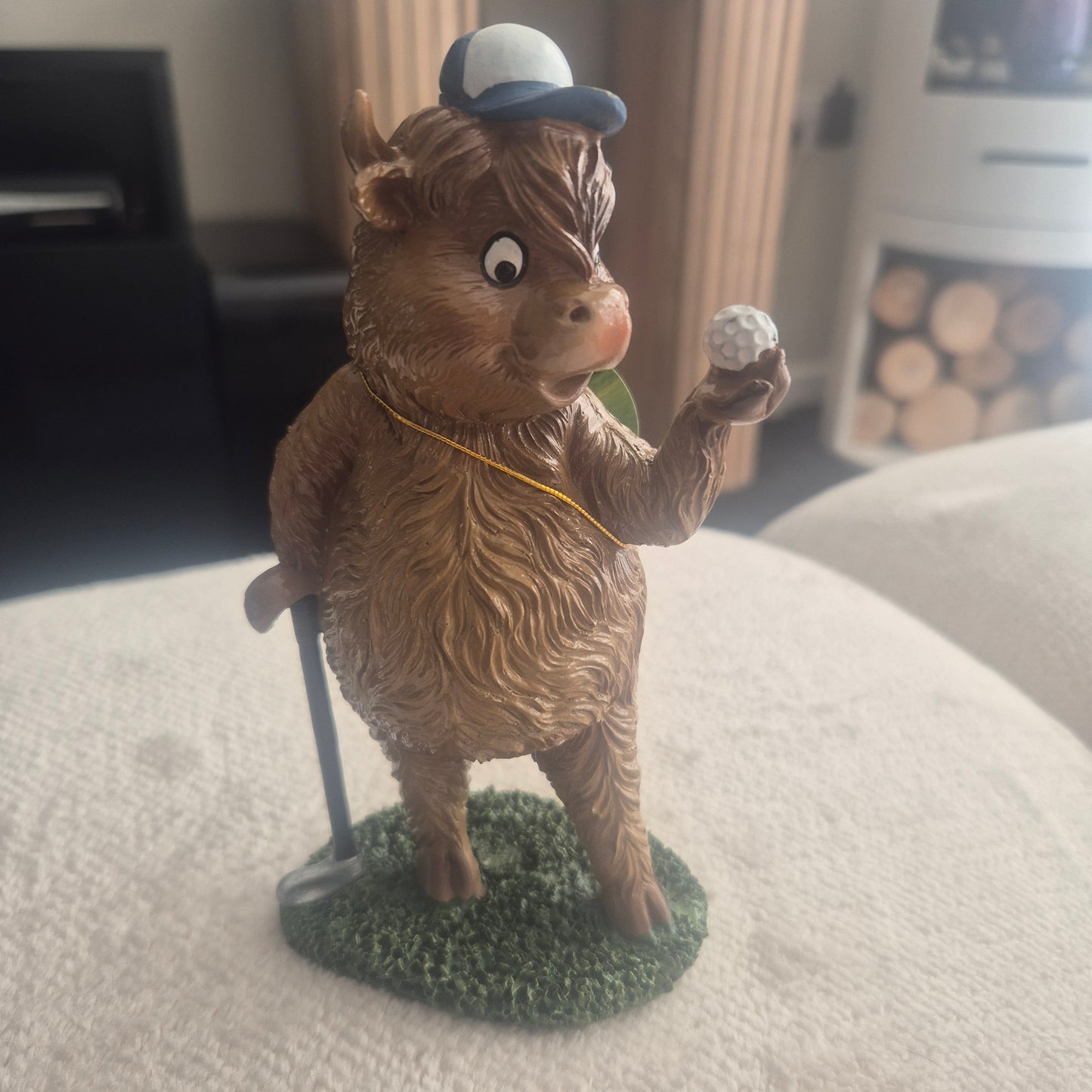 Golfing Highland cow