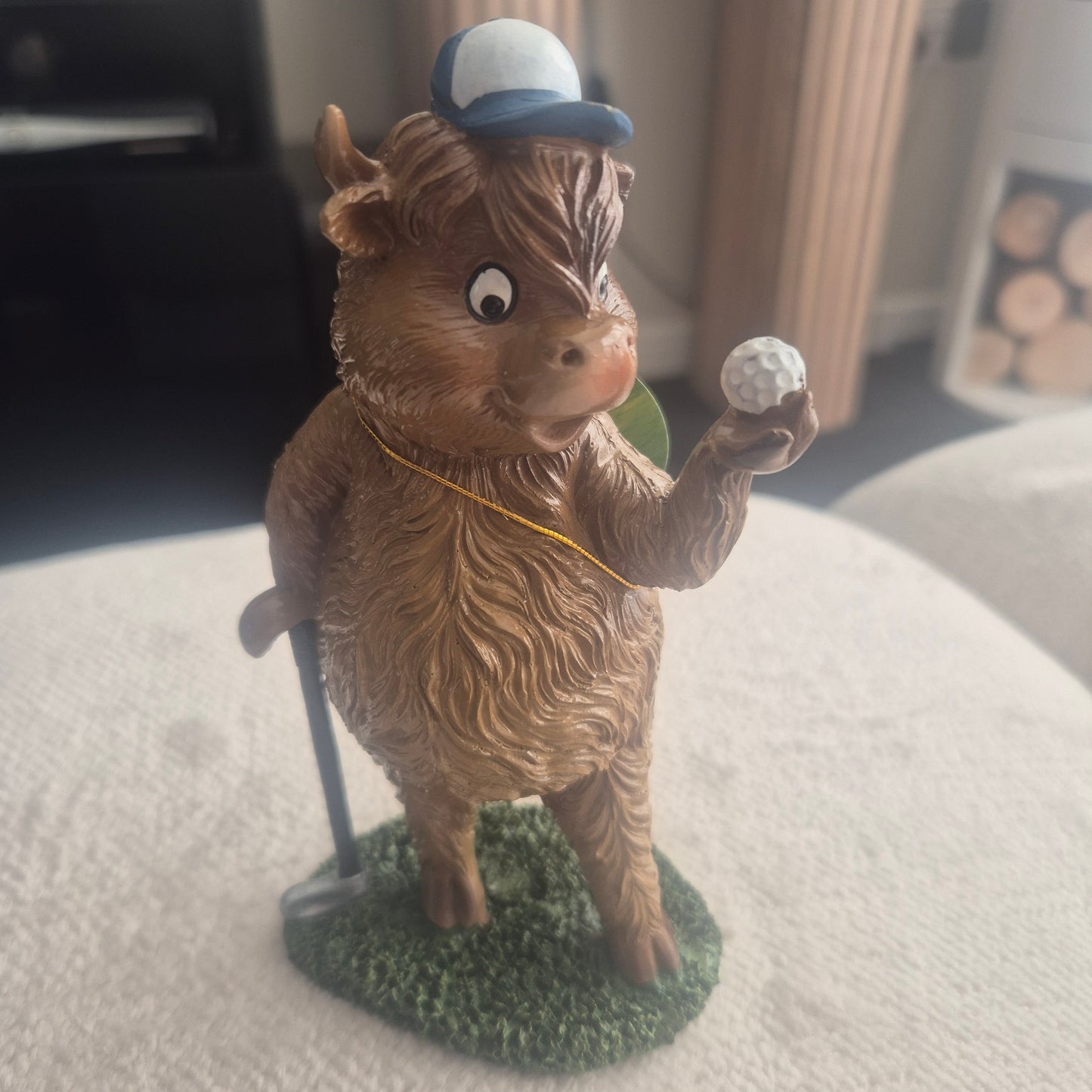 Golfing Highland cow