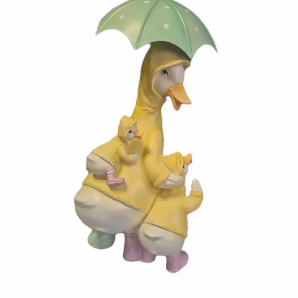 Family of Ducks Under Umbrella