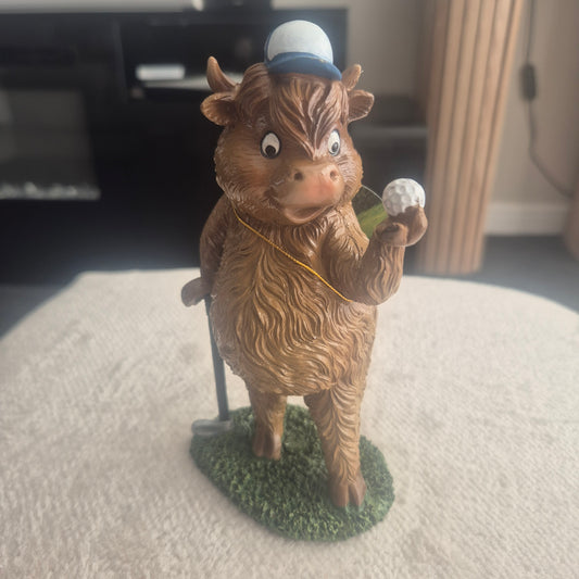 Golfing Highland cow
