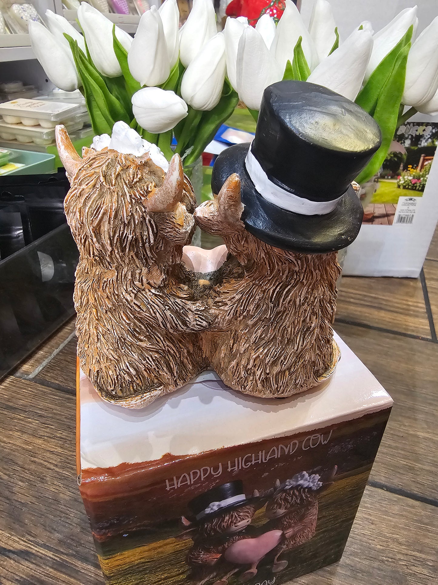 Happy Highland Cow Wedding Day statue with dangling legs