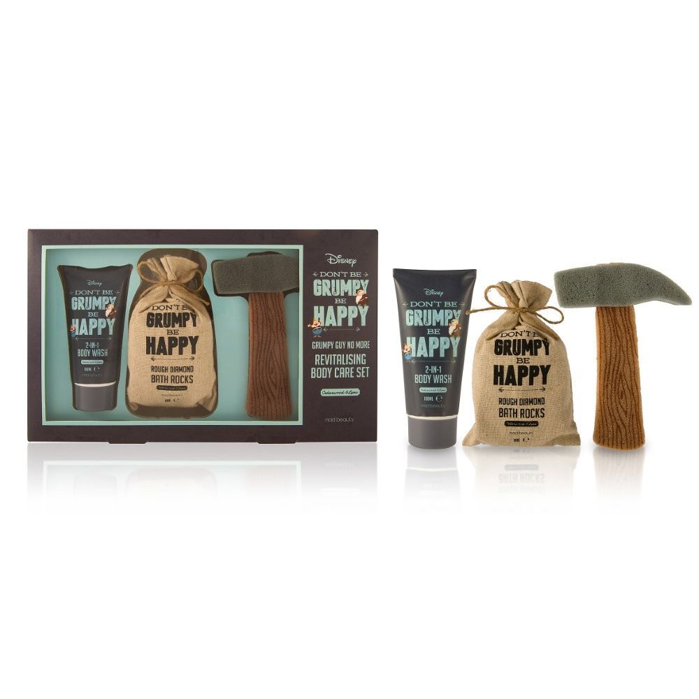Mad Beauty Disney Grumpy Revitalizing Body Care Set featuring a cedarwood and lime body wash, bath rocks, and a novelty pickaxe-shaped sponge