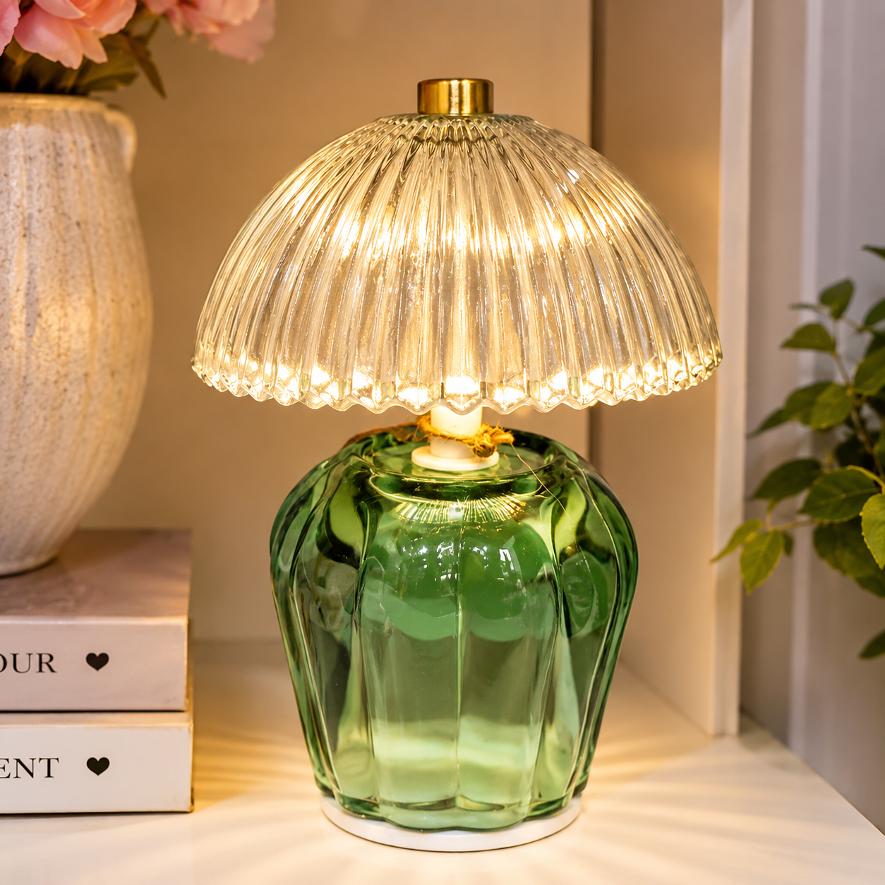 A softly ribbed glass table lamp in green, designed to create a gentle ambient glow. Battery operated and powered by two AAA batteries, it offers flexible placement without the need for cables.

Finished with a clear ribbe

Ribbed Glass Table Lamp – Green